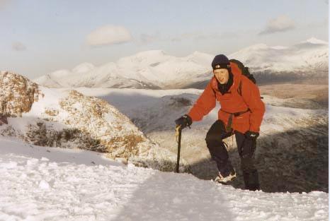 Alex reaches the top of Buchaille Etive Mor.  Ben Nevis can
           be seen in the distance.