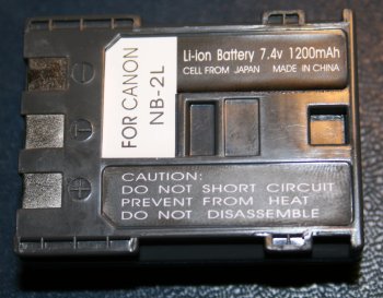 Battery marked 'Li-ion Battery 7.4v  1200mAh CELL FROM JAPAN MADE IN CHINA FOR CANON NB-2L'