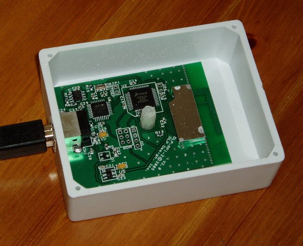 PCB with USB connector inside a white  plastic box
